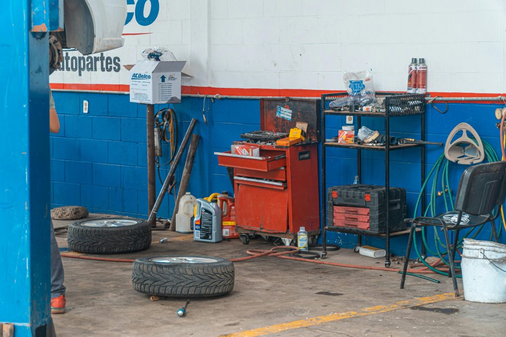 A detailed view of an auto repair garage interior showcasing tools and equipment.